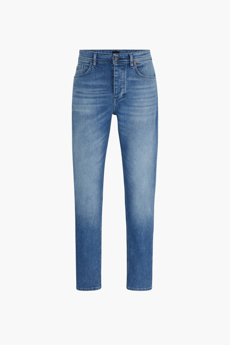 Taps toelopende jeans in middinblauw denim van BOSS ORANGE, met oranje stikseldetails.