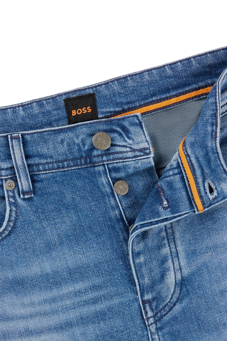 Jean fuselé en denim bleu moyen de BOSS ORANGE, avec des détails de couture orange.
