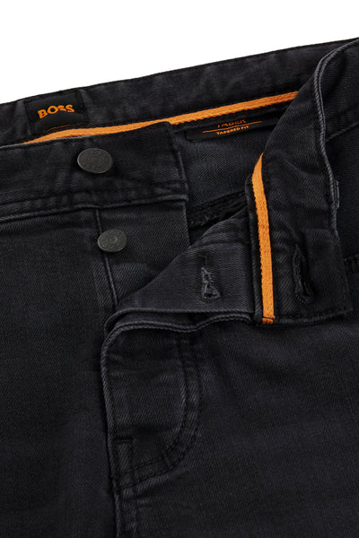 Jean fuselé gris foncé de BOSS, avec boutons et détail orange sur la ceinture.