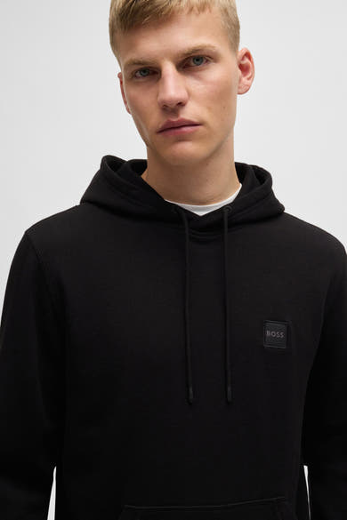 Sweat à capuche noir de BOSS ORANGE, avec cordon et logo ton sur ton sur le devant.