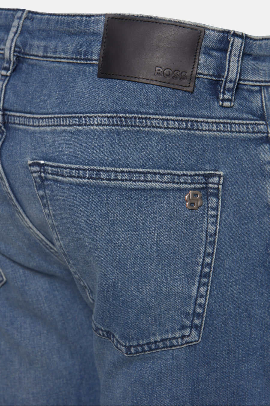 Jean slim en denim bleu moyen de BOSS ORANGE, avec logo sur la poche arrière.
