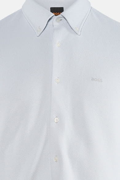 Chemise à manches longues grise par BOSS ORANGE, avec col boutonné et texture piquée discrète.