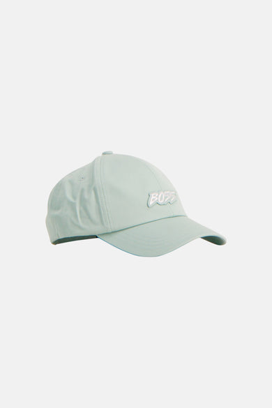 Casquette turquoise de BOSS ORANGE avec le logo 'BOSS' blanc en relief en vue de côté.