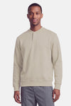 Sweat à col roulant beige de BOSS ORANGE, coupe droite, détail plaque discrète sur la poitrine, manches longues et ourlets côtelés, vue frontale.