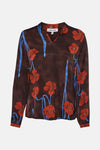 Bruine met lange mouwen in bruin van MORE & MORE met rode bloemenprints en blauwe stelen.