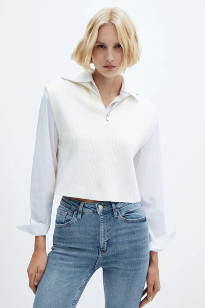 Blue skinny jeans with slim fit and classic five-pocket design, worn with white ribbed top and button-down shirt, front view
