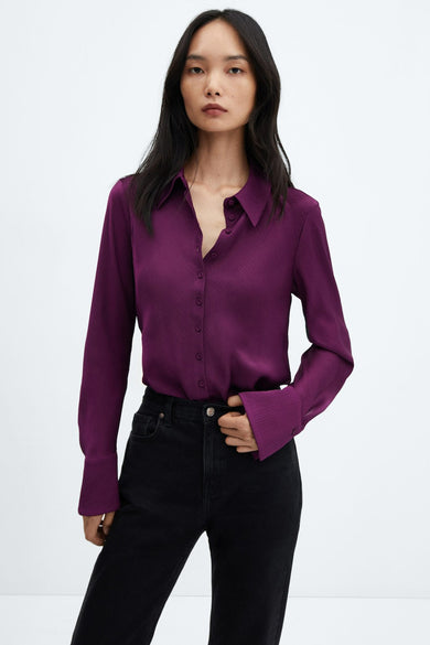 Mauve long-sleeve ribbed blouse with button-down front and classic collar, worn with black jeans, front view