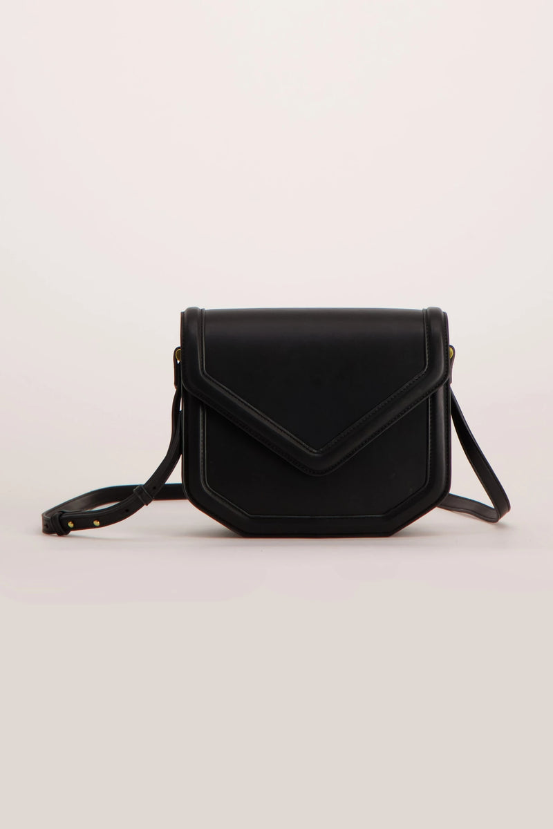 Black leather crossbody bag with flap closure and adjustable strap, front view