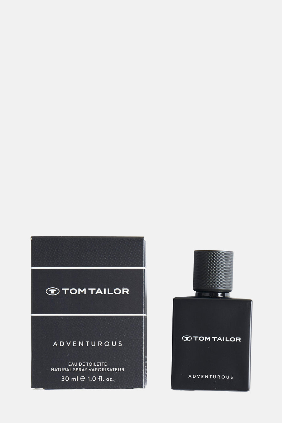 Flacon de parfum noir par Tom Tailor, présenté avec son emballage assorti.
