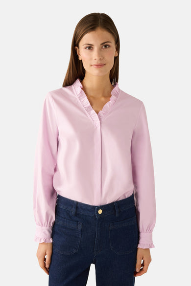 Roze blouse met lange mouwen van MORE & MORE, met delicate ruche bij de kraag en zichtbare broekzakken.