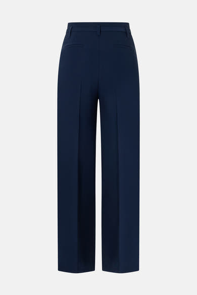 Pantalon de costume bleu marine de MORE & MORE, avec des poches arrière discrètes et une coupe large.