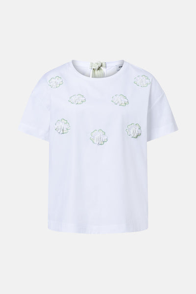 White short-sleeve T-shirt with green-trimmed floral embroidery and neck tie detail by MOP, front view