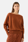 Cognac round-neck sweater by MORE & MORE, featuring relaxed fit, ribbed cuffs and waistband, front seam detail, worn with matching ribbed pants in lifestyle shot