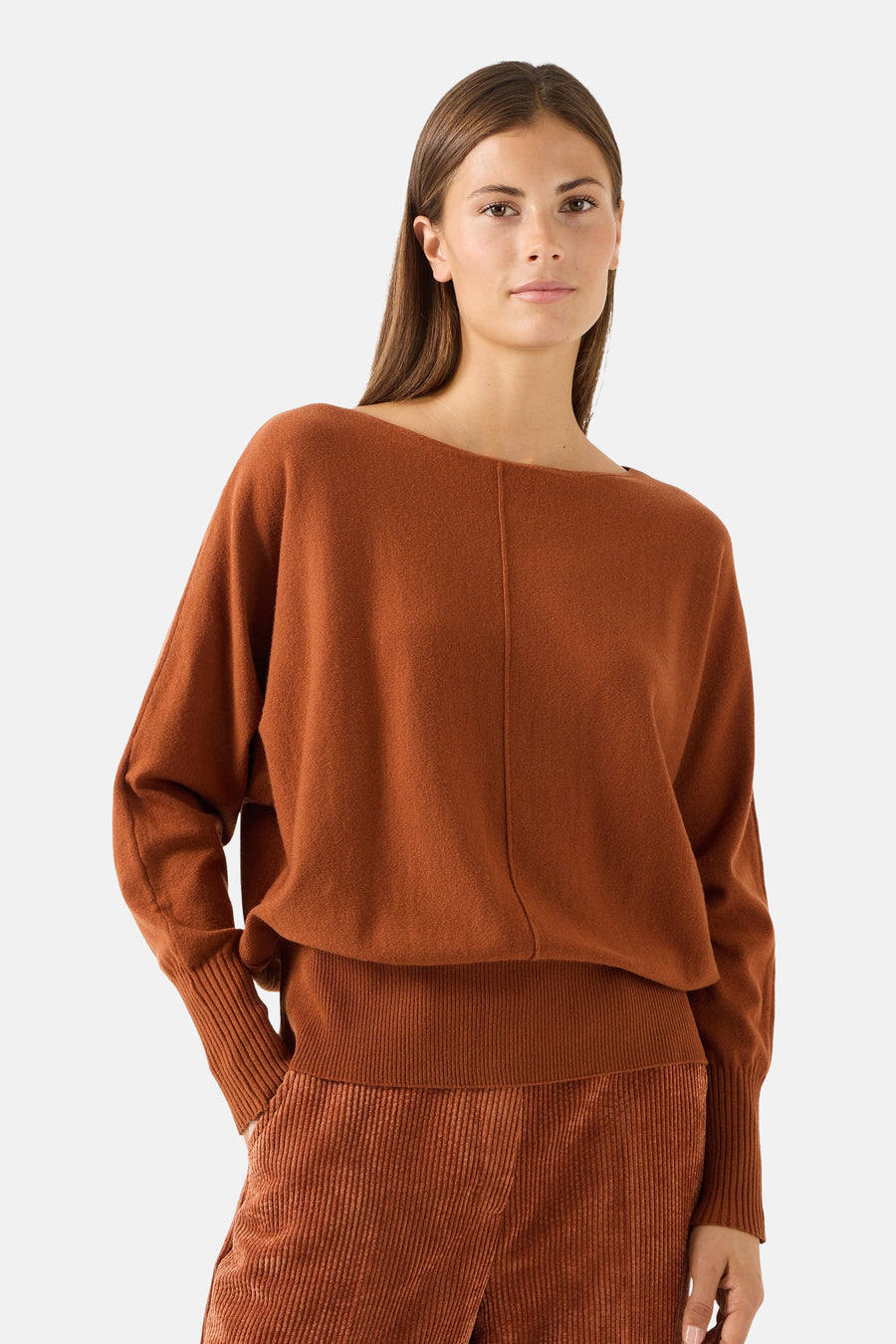 Cognac round-neck sweater by MORE & MORE, featuring relaxed fit, ribbed cuffs and waistband, front seam detail, worn with matching ribbed pants in lifestyle shot