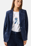 Navy corduroy blazer by MORE & MORE, featuring ribbed texture and single-button front, worn with white graphic tee and matching pants in lifestyle view