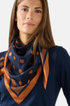 Multicolored silk foulard with navy blue base and orange polka dots, by MORE & MORE, featuring dotted border and draped neck styling