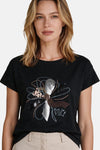 Black short-sleeve T-shirt by MORE & MORE with sequined floral graphic and "vive la VIE!" text, front view on model