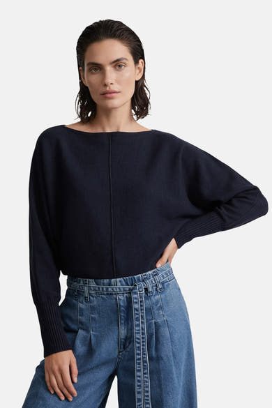 Navy blue round-neck sweater by MORE & MORE, featuring ribbed cuffs and a relaxed fit, worn with high-waisted jeans in a front lifestyle view.