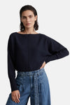 Navy blue round-neck sweater by MORE & MORE, featuring ribbed cuffs and a relaxed fit, worn with high-waisted jeans in a front lifestyle view.