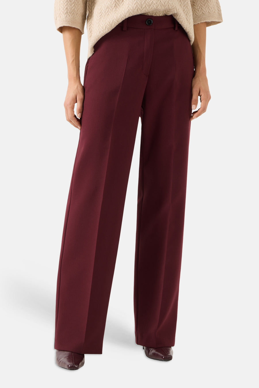 Burgundy wide-leg suit pants by MORE & MORE, featuring front pleats and a high waist, shown with beige sweater and dark brown shoes in front view.