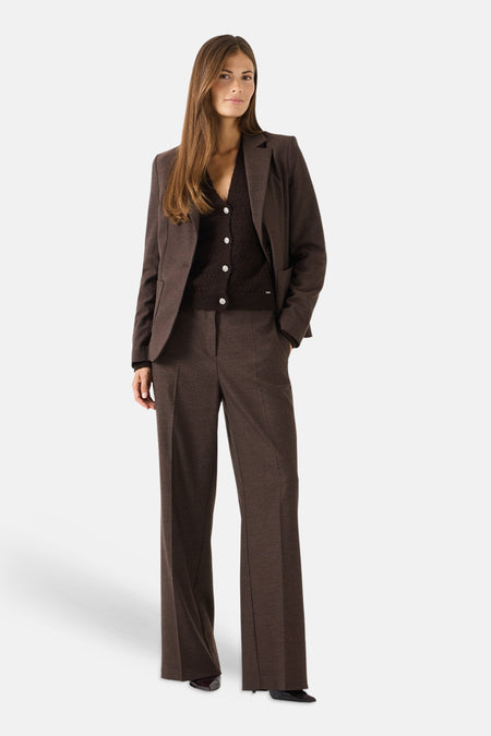 Brown wide-leg suit trousers by MORE & MORE, featuring a textured wool blend, front pleats, and a straight fit, shown with matching blazer in full-length lifestyle view.