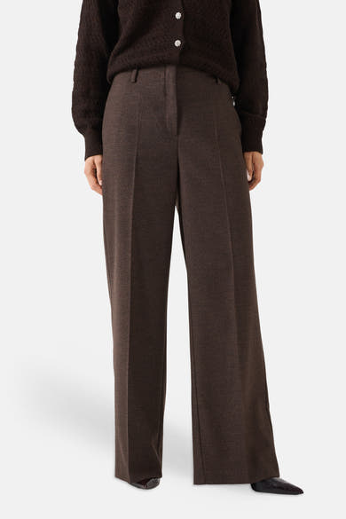 Brown wide-leg suit trousers by MORE & MORE, featuring front pleats and a textured wool blend, shown with a dark knit top and pointed shoes in a full-front view.