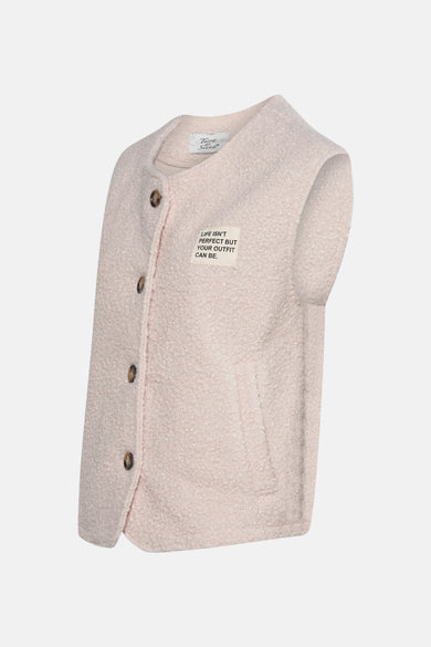 Veste sans manches écru de Terra di Siena, avec boutons marron et étiquette à texte.