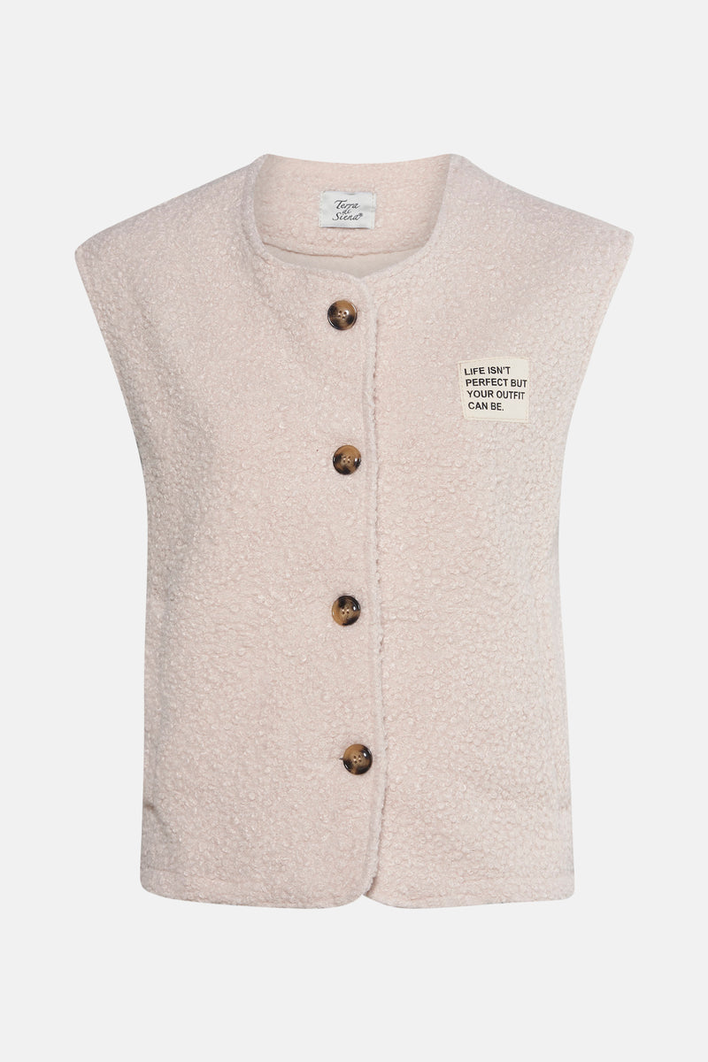 Veste sans manches écru de Terra di Siena, à texture bouclée et fermeture boutonnée sur fond neutre.