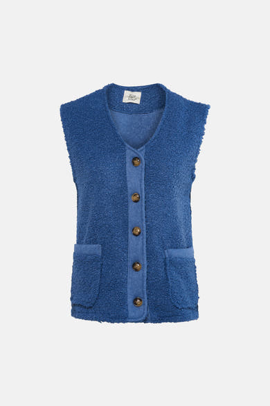Gilet bleu en bouclette de Terra di Siena avec boutonnage sur le devant et poches plaquées.