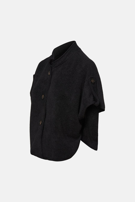 Cardigan noir en maille texturée de Terra di Siena, avec fermeture boutonnée et manches courtes.