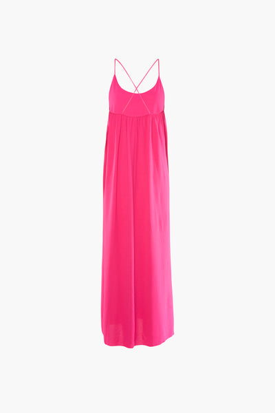 Bright pink midi robe with crisscross spaghetti straps and flowing fabric, back view on white background