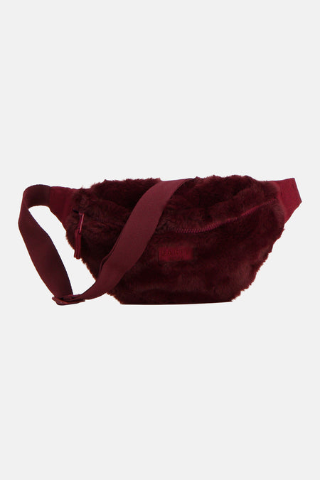 Sac banane rouge foncé en matière pelucheuse avec bandoulière réglable et fermeture zippée, BARTS