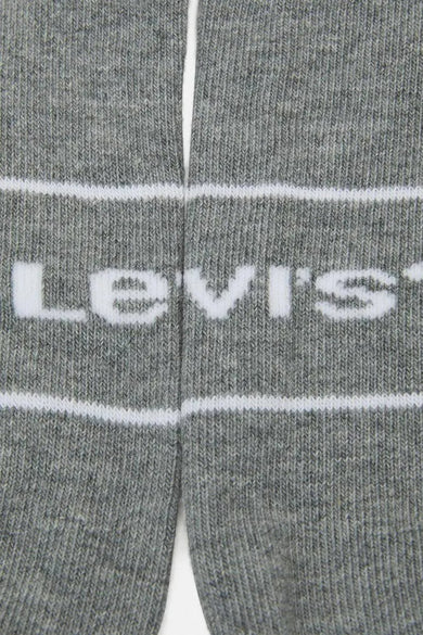 Chaussettes grises by Levi's®, avec rayures blanches et logo de la marque.
