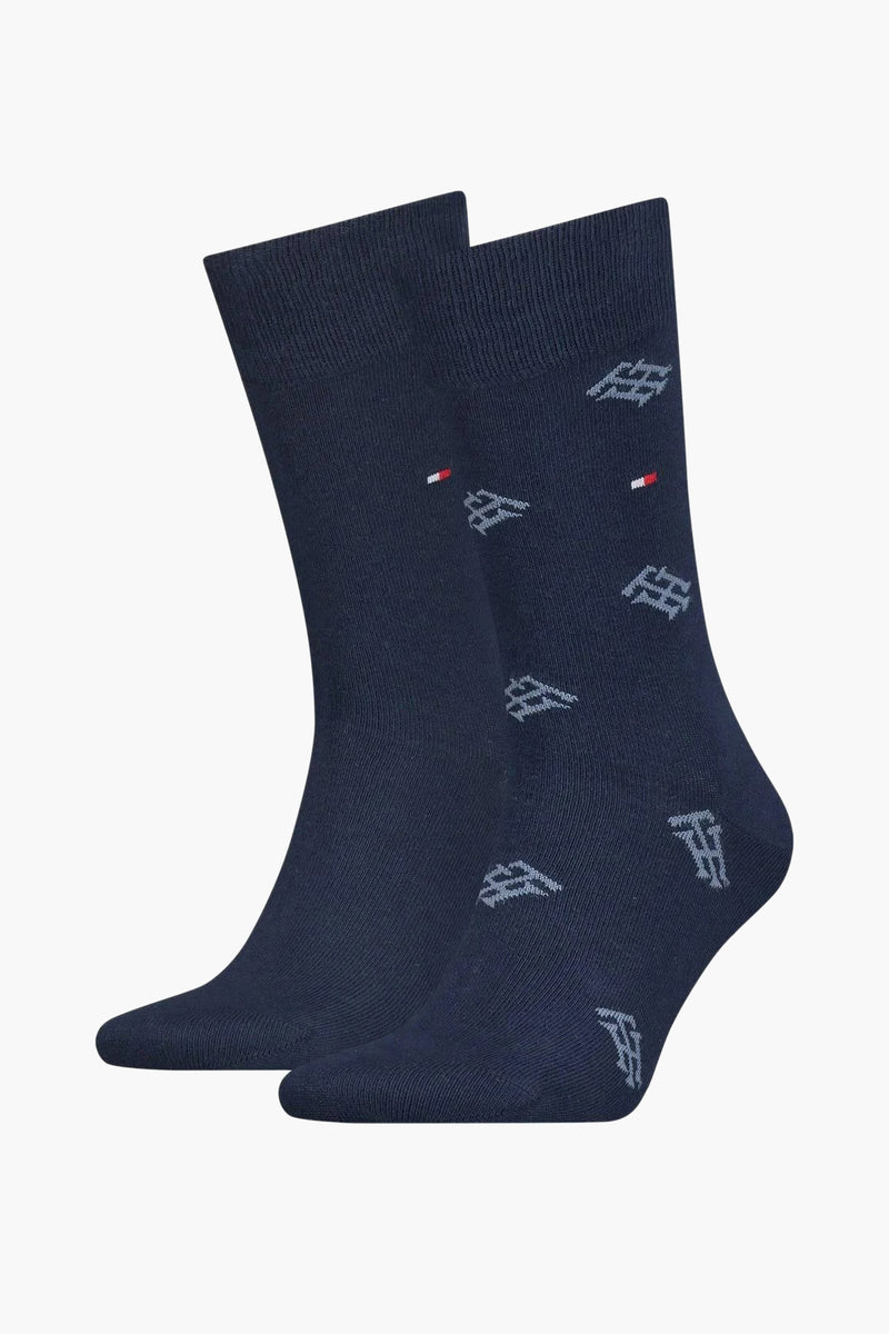 Navy blue socks with white logo pattern and red-white-blue flag detail, ribbed cuff, side view