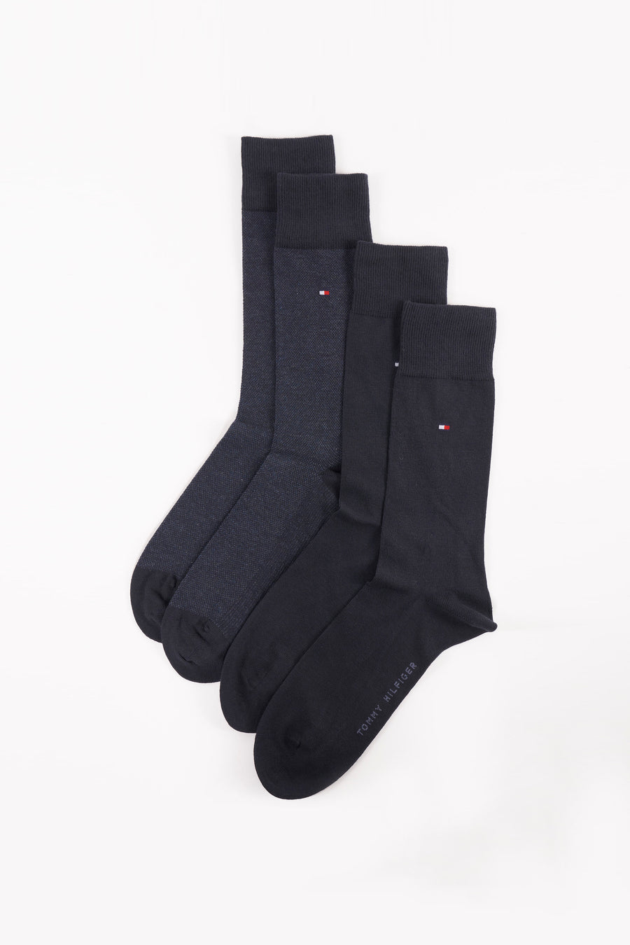Chaussettes bleues unies de Tommy Jeans avec logo subtil sur le côté et différentes textures.