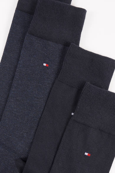 Chaussettes bleues de Tommy Jeans avec des motifs texturés et le logo emblématique de la marque brodé.
