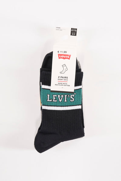 Chaussettes courtes noires par Levi's, à rayures blanches et vertes avec le logo de la marque.
