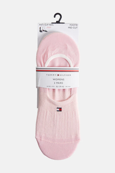 Chaussettes roses pour femmes de Tommy Hilfiger, avec motif côtelé et logo drapeau.