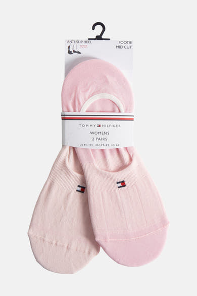 Chaussettes roses de Tommy Jeans avec logo drapeau et coupe mi-basse.