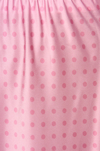 Jupe longue rose de Terra di Siena, à pois ton sur ton et à texture plissée.