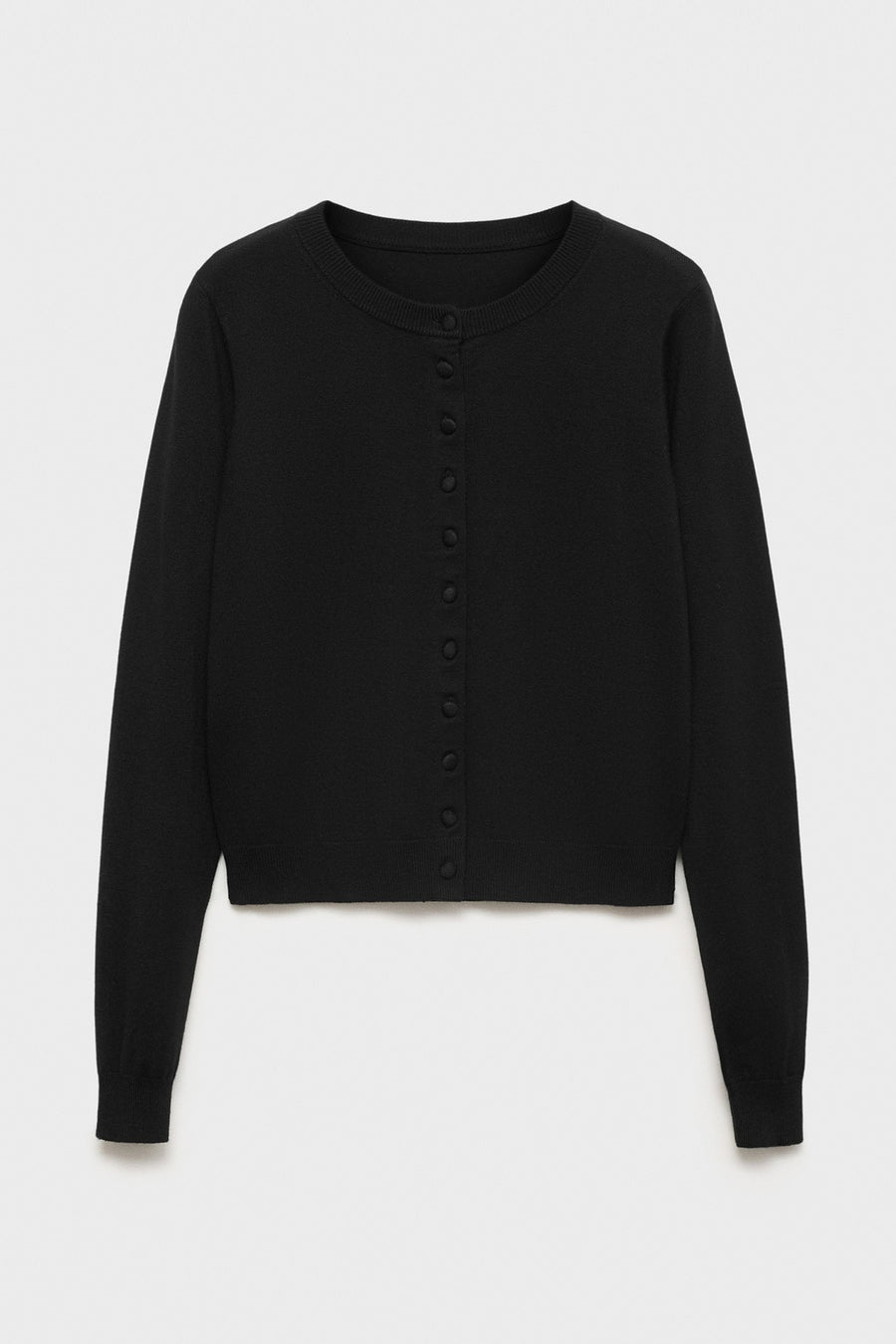Gilet noir à boutons par MANGO, en maille fine unie, devant un fond neutre.
