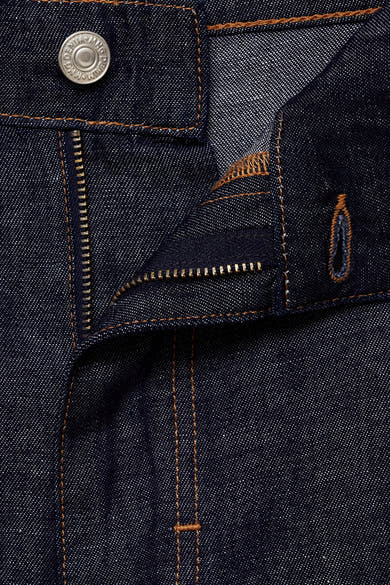 Short en denim bleu moyen par MANGO, avec fermeture éclair et bouton visible.