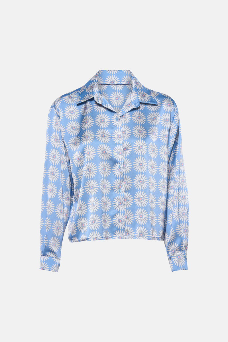 Blauw overhemd met lange mouwen van Terra di Siena met wit bloemenpatroon, gedragen met een casual spijkerbroek.