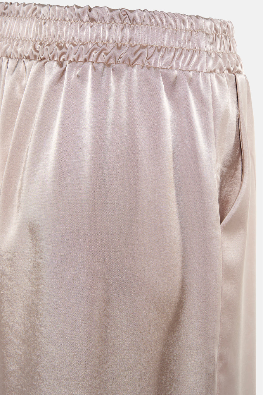 Pantalon beige de Terra di Siena avec taille élastique et une poche visible sur le côté.