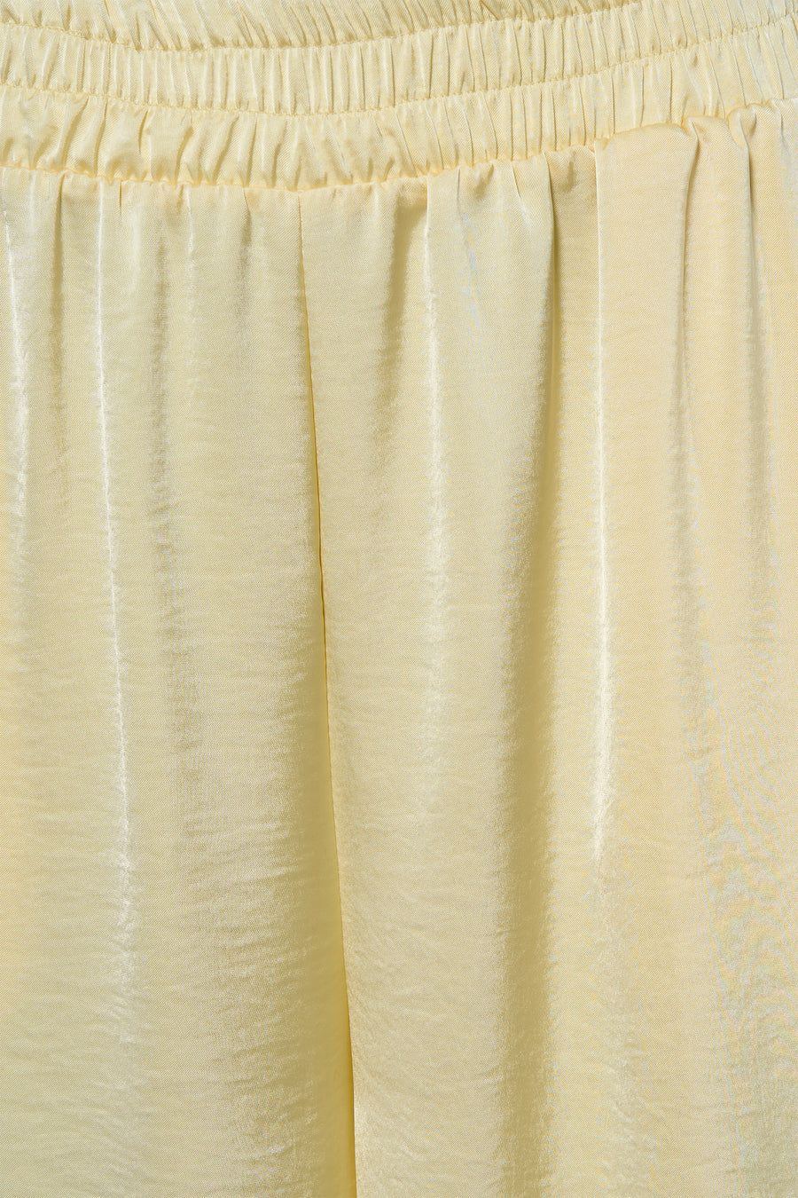 Pantalon jaune de Terra di Siena avec taille élastique et texture satinée.