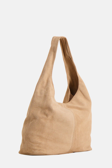 Ecru suede shoulder bag with soft texture and slouchy design, front view