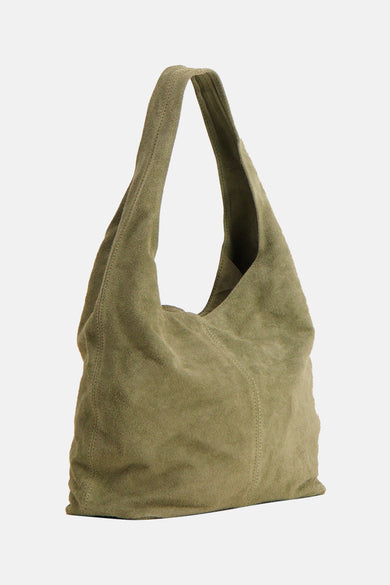 Olive green suede shoulder bag with slouchy design and single long strap, front view