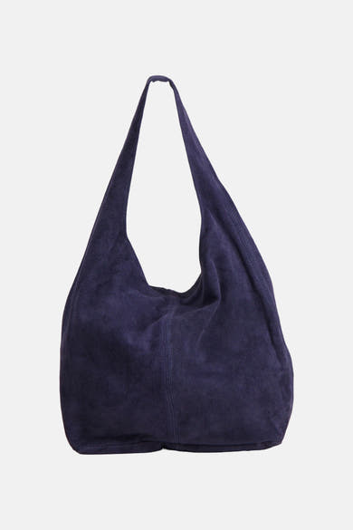 Navy blue suede shoulder bag with slouchy design and long strap, front view