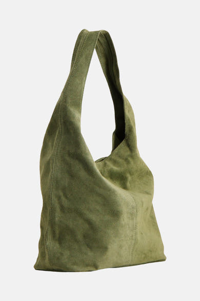 Kaki suede shoulder bag with slouchy design and wide strap, side view showing soft texture and natural folds