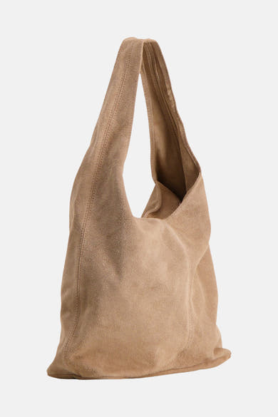Taupe suede shoulder bag with soft slouchy design and long adjustable strap, front view
